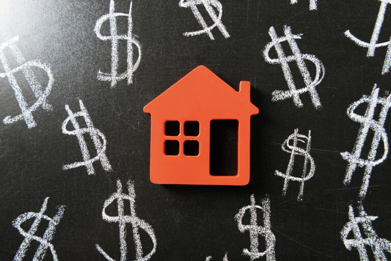 red house graphic with dollar signs on a chalkboard