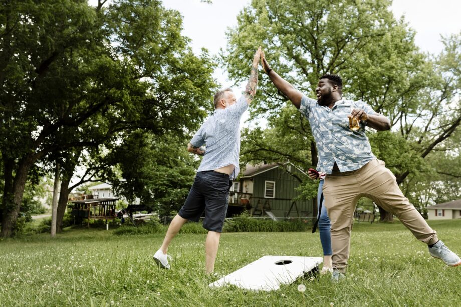 Airbnb guests enjoying a game of cornhole