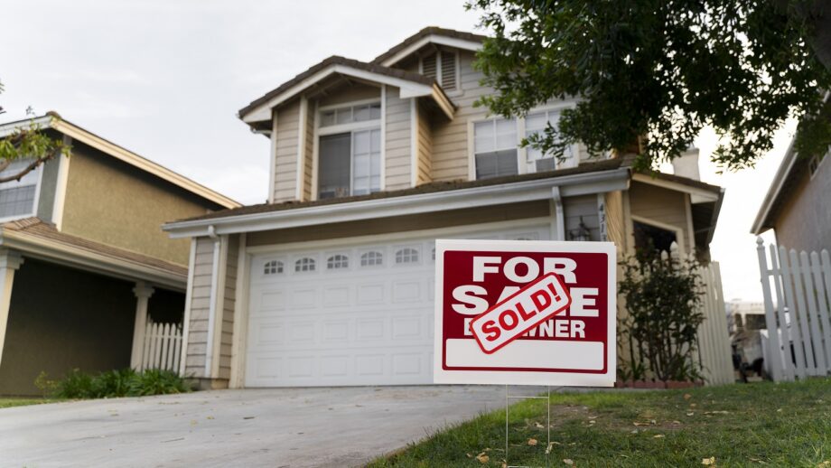 A house with a sold sign